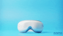 a blue background with a renpho logo and an eye massager