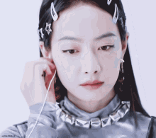 a close up of a woman 's face with chinese characters on the bottom right