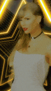 a woman in a white dress is standing in front of a star