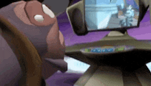 a cartoon character is looking at a computer monitor .