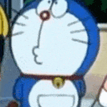 a blue and white cartoon character with a bell around his neck .