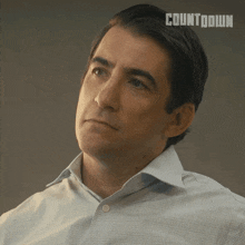 a close up of a man 's face with countdown written on the bottom