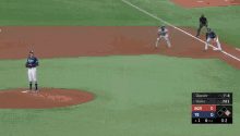 a baseball game is being played with ads for morgan auto group
