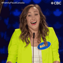 a woman in a neon yellow jacket has a name tag that says mar