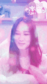 a woman is smiling in front of a valentine 's day card that says you make my heart smile