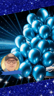 a man wearing glasses is surrounded by blue balloons with a crown on his hat