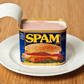 a can of spam with a hamburger on it on a white plate