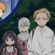 a boy and a girl are standing next to each other
