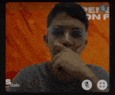 a man wearing glasses is on a video call with the name italo on the bottom right