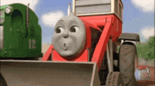 a cartoon train with the number 12 on the side of it