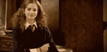 hermione granger from harry potter is making a funny face .