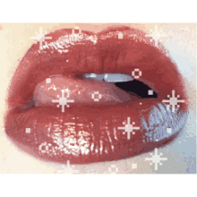a close up of a woman 's lips with red lipstick and sparkles
