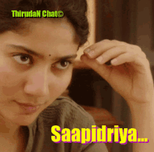 a close up of a woman 's face with the words saapidriya written on the bottom