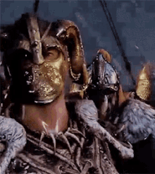 a close up of a man wearing a helmet and a mask
