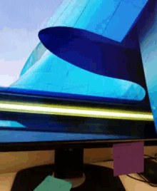 a computer monitor with a blue airplane on the screen