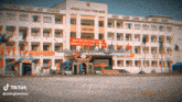 a building with a sign that says " muon gan ket duyen no doi mình "