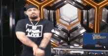 a man wearing a shirt that says angel live is dancing