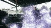 a man is surrounded by purple flames and smoke