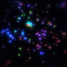 a black background with a bunch of colorful dots on it