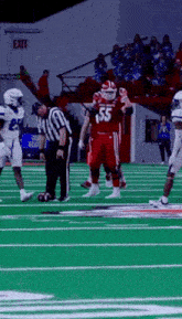 a football player in a red jersey with the number 55