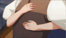 a person holding another person 's stomach with animefull.net written in the corner