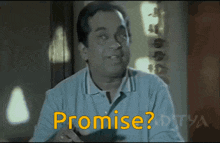 a man in a blue shirt says promise