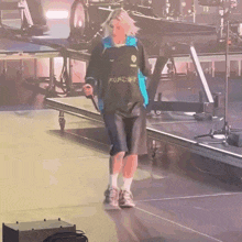 a person on a stage with a shirt that says ' a ' on the front