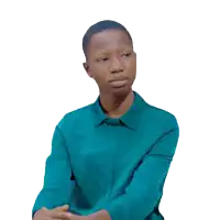 a woman wearing a blue shirt is sitting with her hands folded