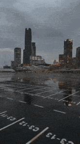 a parking lot with a city skyline in the background and the numbers c3 and c2 on the ground
