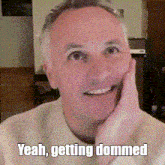 a man with his hand on his face and the words yeah getting dommel on the bottom