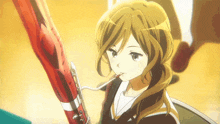 a girl in a ponytail is playing a bassoon