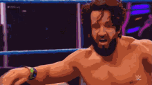 a shirtless wrestler with a beard is in a wrestling ring with the letters wwe on his chest