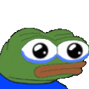 a green frog with big eyes is wearing a blue shirt and has tears in his eyes .