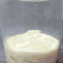 a clear cup filled with a white liquid that says mr. cakes on the bottom