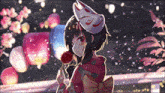 a girl wearing a fox mask and a kimono is holding a lollipop .