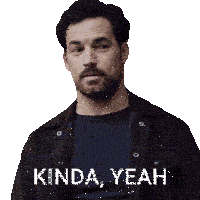 a man with a beard is wearing a black shirt and a brown jacket with kinda yeah written on it