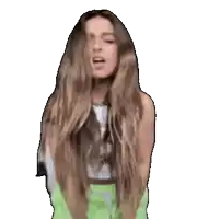 a woman with long hair is wearing a green skirt and a white top .