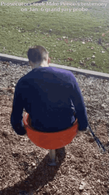 a man sitting on a playground with the words prosecutors seek mike pence 's testimony on jan 6