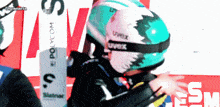 a person wearing a helmet with uvex written on it