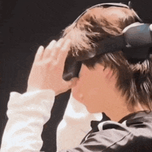 a man wearing a virtual reality headset is looking at something