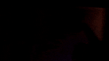 a black background with a green glowing object in the middle