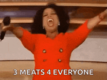 a woman in a red dress is holding a microphone with her arms outstretched and says 3 meats 4 everyone .