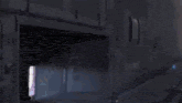 a robot with a blue head is standing in a room with a door .