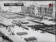 a black and white photo of a military parade with the date 19/25
