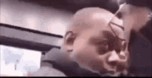 a close up of a man 's head with a shadow of a person on it .