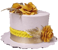 a white and gold cake with yellow flowers on top