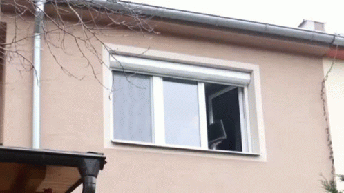 throw computer out window gif