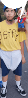 a boy in a yellow shirt that says jeffy on it