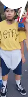a boy in a yellow shirt that says jeffy on it