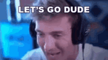 a man wearing headphones is saying `` let 's go dude '' while looking at a computer screen .